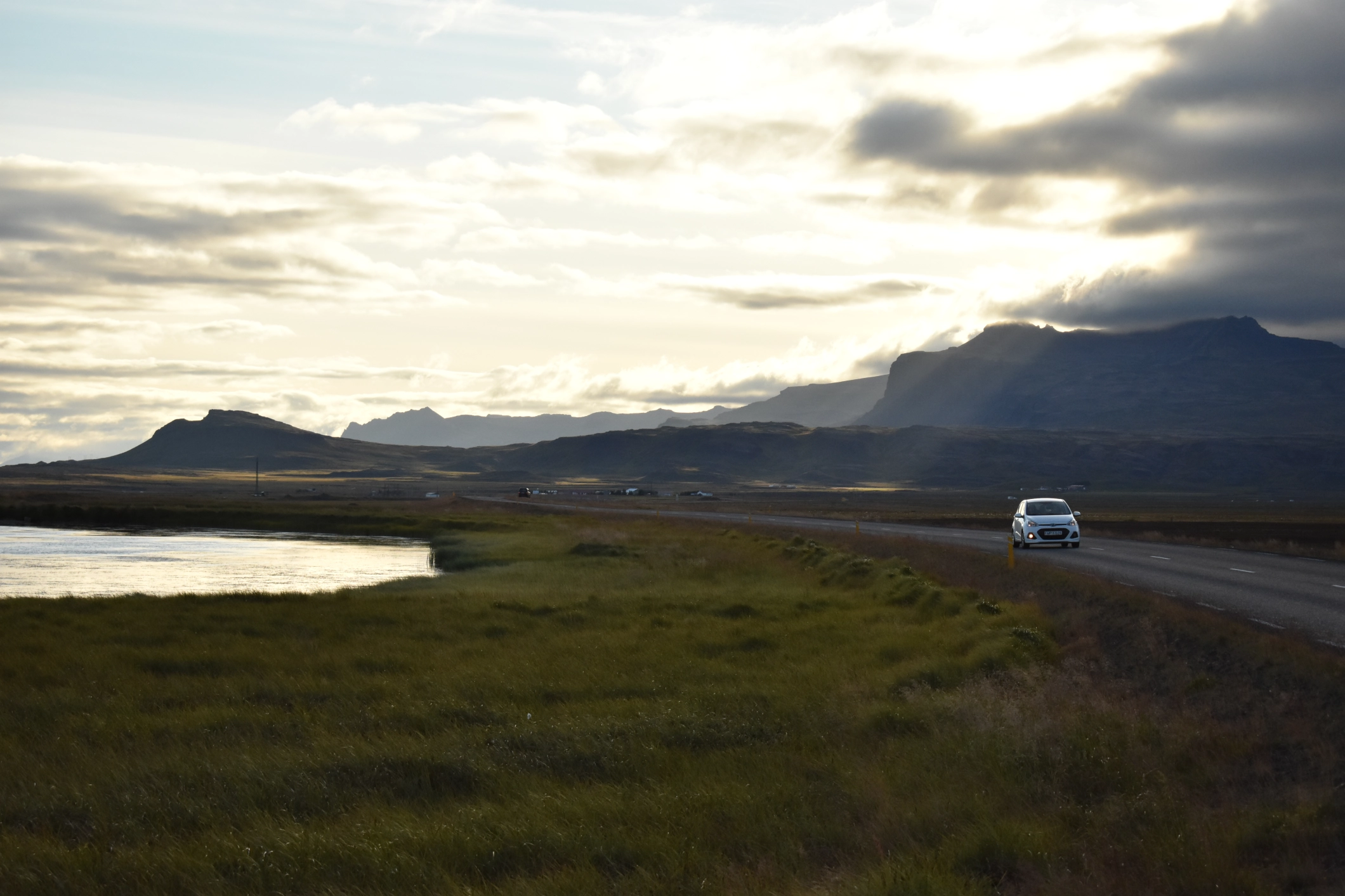 A car driving through Iceland's hills