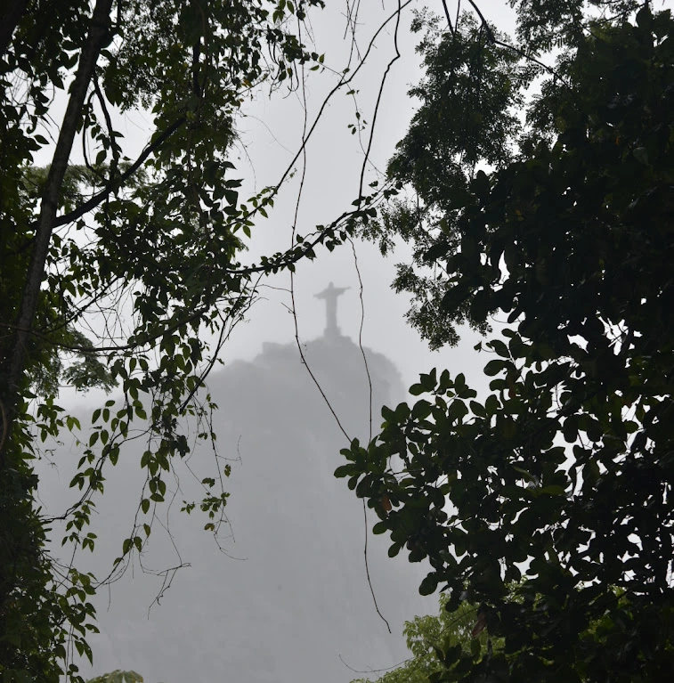 Christ the Redeemer silhouetted through the clouds