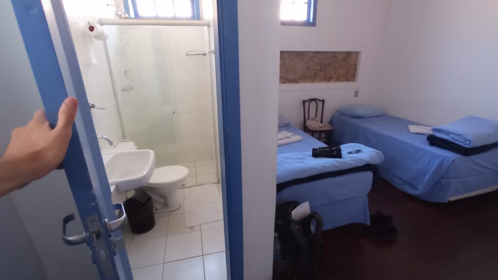 My accommodation in Santuario do Caraca, with the beds and bathroom