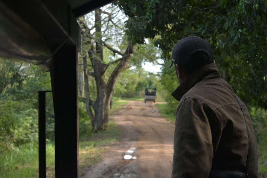 A guide looking out towards one of Pantanal Jungle Lodge's jeeps
